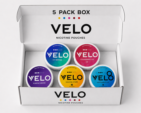 A white VELO nicotine pouches 5-pack box containing five round tins of nicotine pouches in different colors: blue, pink, purple, yellow, and teal. The box lid is open, displaying the VELO brand name and product details.