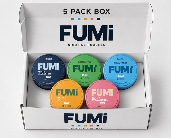 An open white FUMi nicotine pouches 5-pack box containing five round tins in different colors: navy blue (Mint Blueberry), green (Green Apple), light blue (Freshly Mint), orange (Brickly Peach), and pink (Tanky Strawberry).